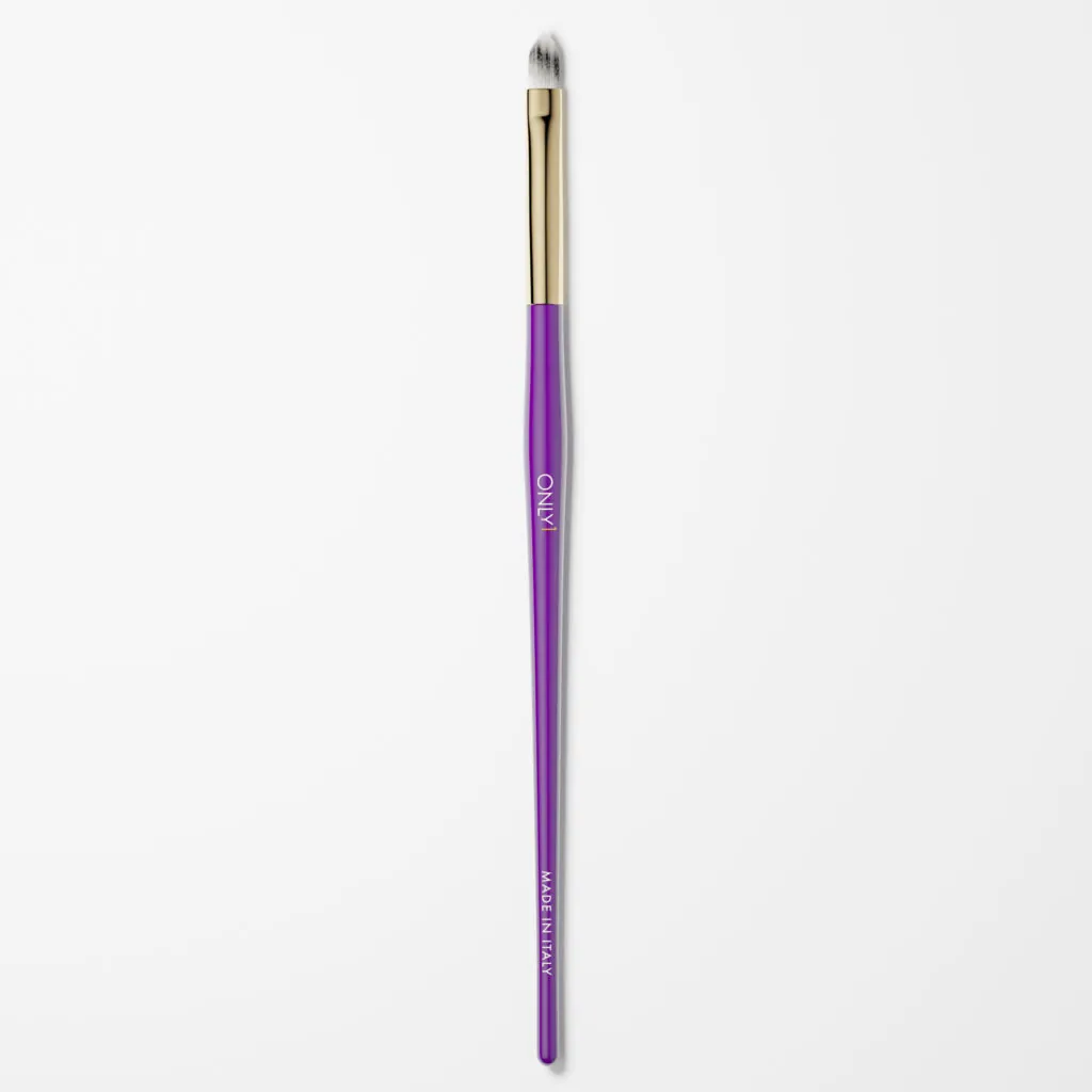 Purple and gold cat tongue makeup brush with white bristles on a plain white background.