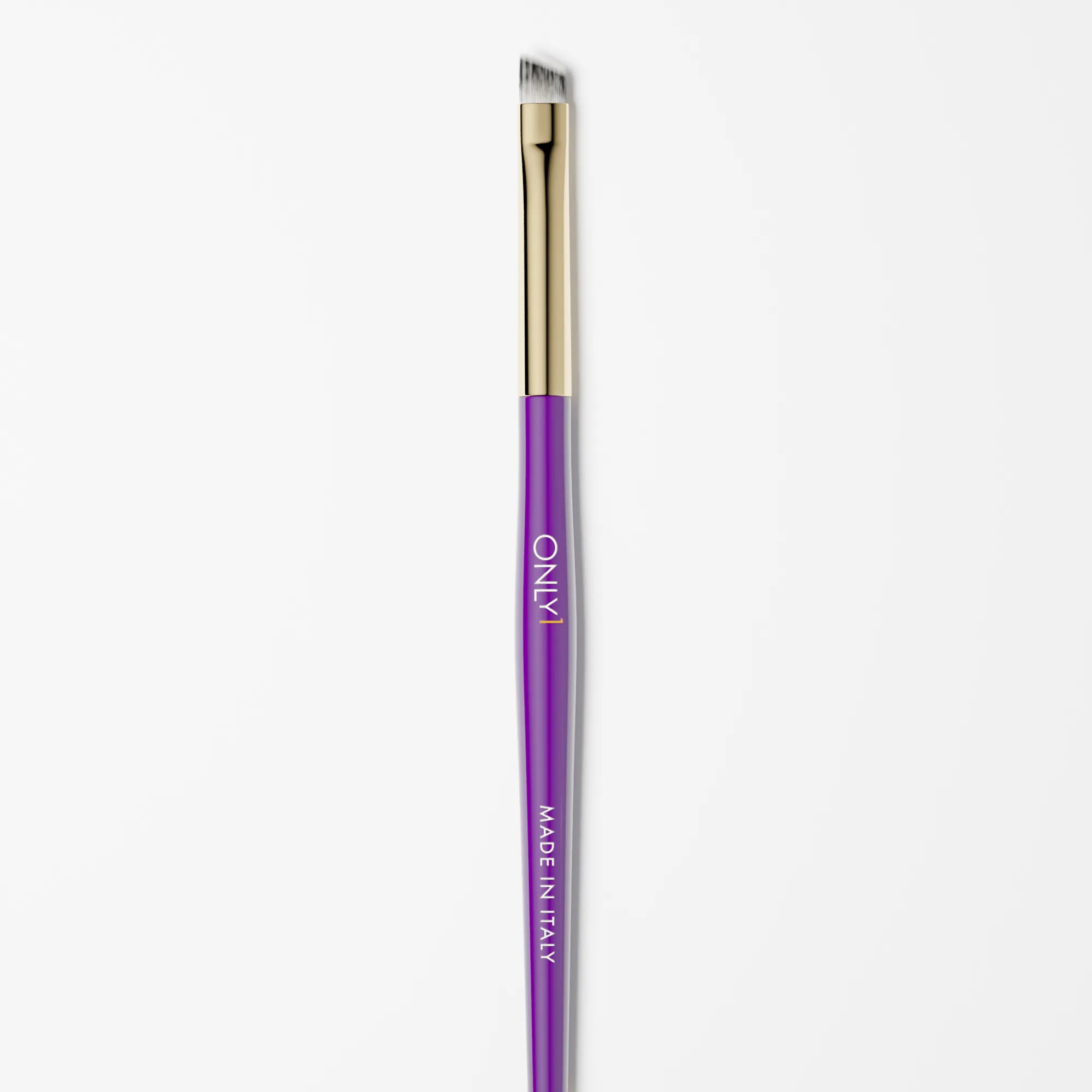 Double-ended eyebrow brush with a purple handle and gold accents, featuring an angled brush on one end and a spoolie on the other, on a plain white background.