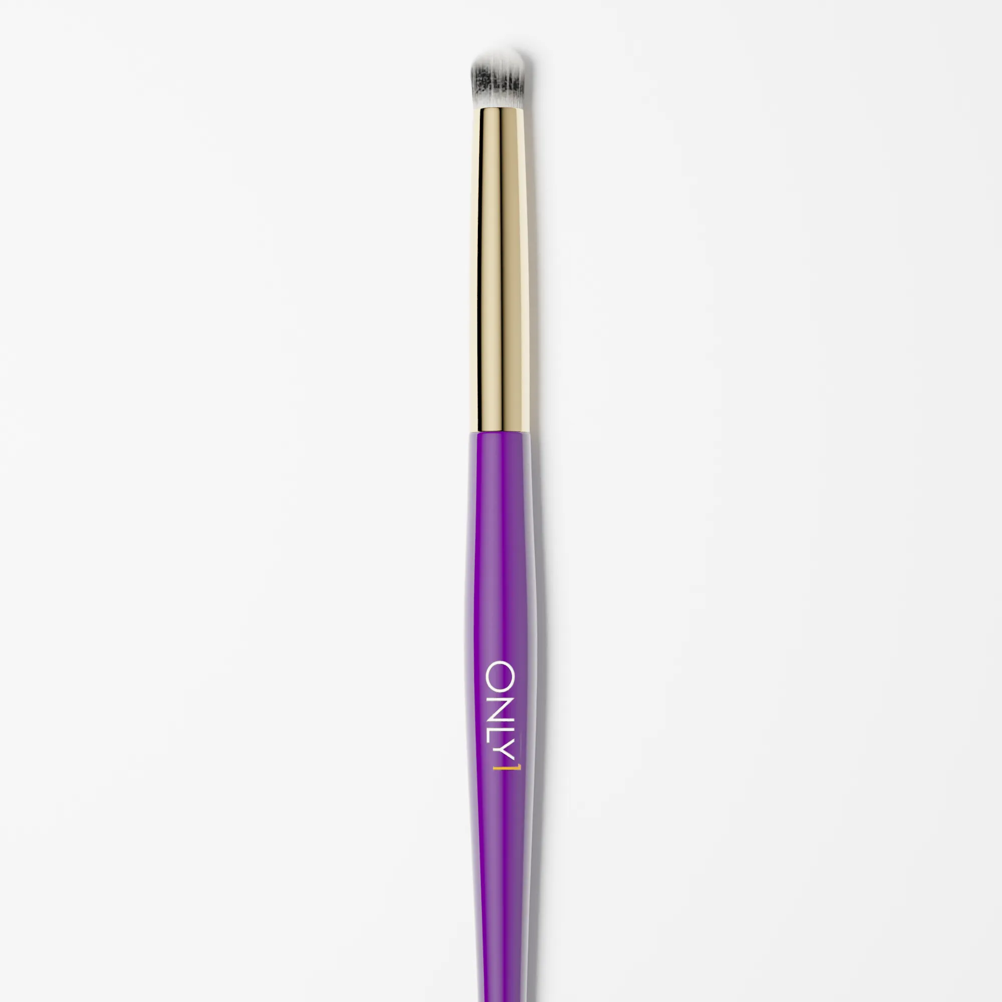 Pencil makeup brush with a purple handle, gold accents, and white bristles on a plain white background.