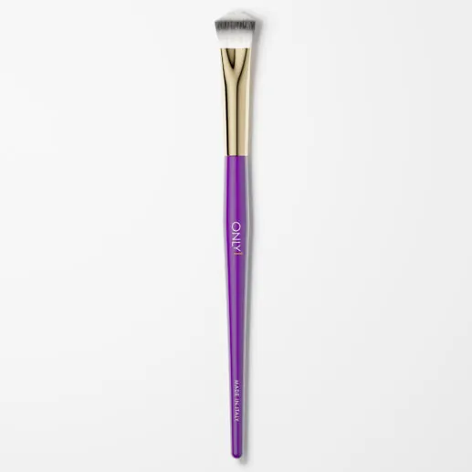 Small concealing brush with a purple handle, gold accents, and white bristles on a plain white background.