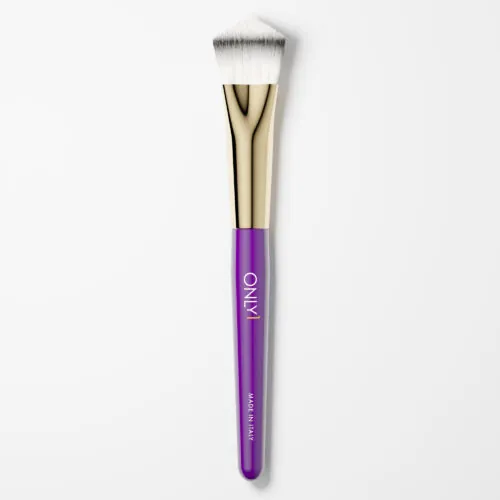 Small foundation brush with a purple handle, gold accents, and dense white bristles on a plain white background.
