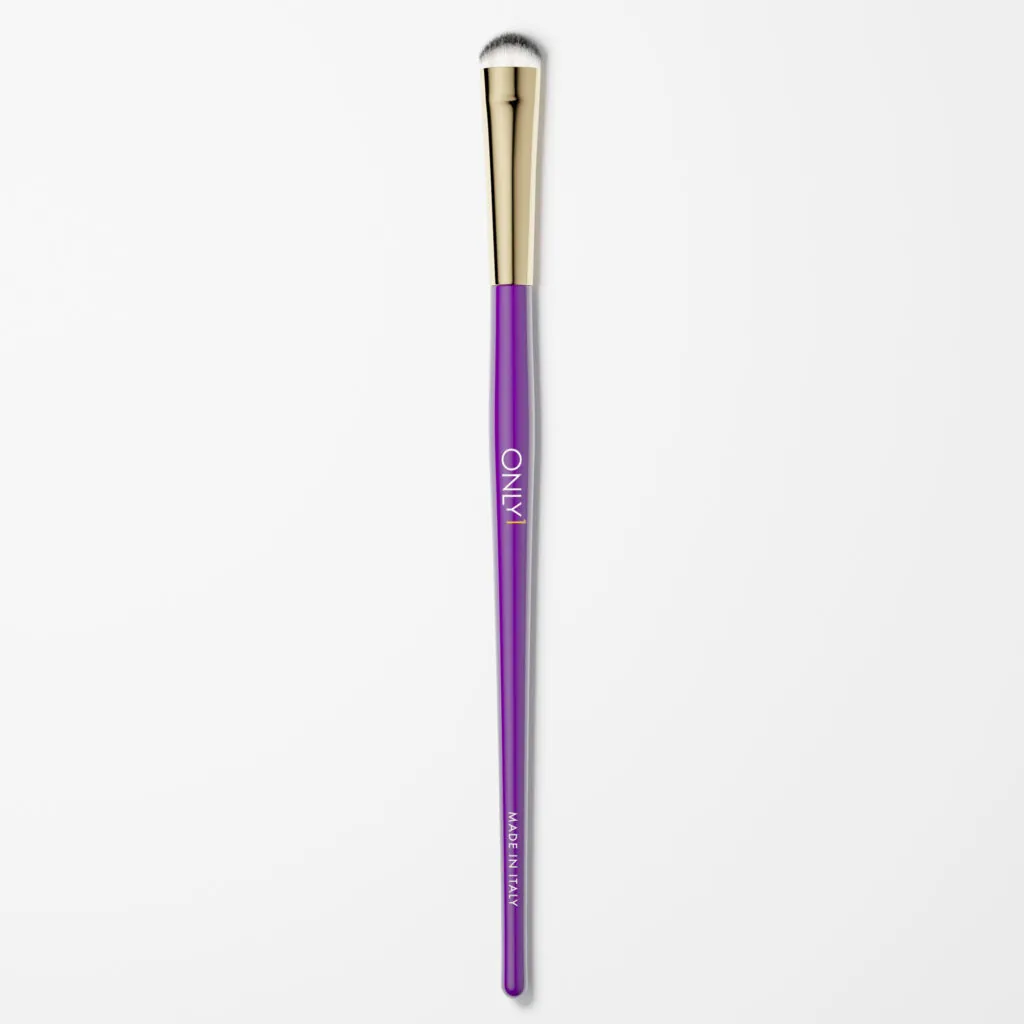 Dense shading brush with a purple handle, gold accents, and white bristles on a plain white background.