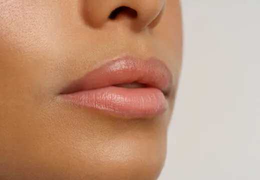 Close-up of soft, healthy lips, indicating someone who knows how to keep lips moisturized and smooth.